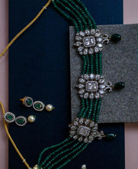 Crystal choker strung together with green quartz beads 