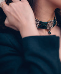 Crystal choker strung together with green quartz beads
