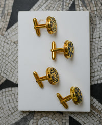 Black intricately hand-carved thewa work on the gold sheet
