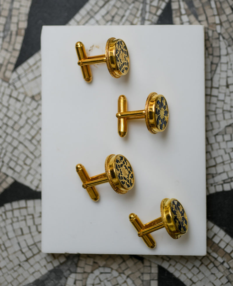 Black intricately hand-carved thewa work on the gold sheet